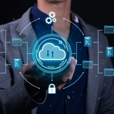 A man employs cloud-based computing on his smartphone to facilitate data transmission and backup. A man employs cloud-based computing on his smartphone to facilitate data transmission and backup.
